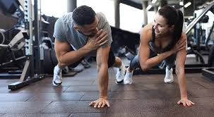 Image of man and woman doing Cardio Gosport  to tone their arms. 